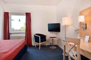 TV a/nebo společenská místnost v ubytování Hotel Jämteborg