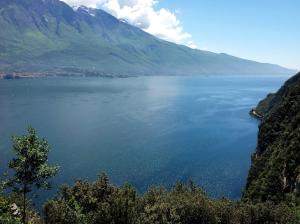 a view of a large body of water with mountains at Casa Bine in Tremosine Sul Garda