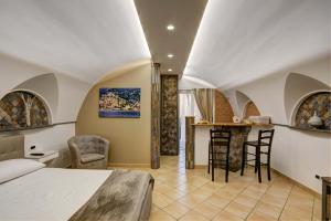 A bed or beds in a room at Cuore di Sorrento Suites