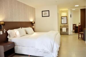 Una cama o camas en una habitación de Hotel Posada La Sorgente