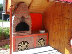 a wood fired oven in a house at Complex Turistic Ocna Sibiului in Ocna Sibiului