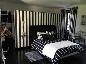 Postel nebo postele na pokoji v ubytování Le Domaine de Cordey