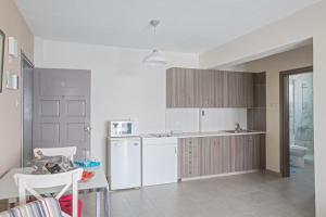 Kuchyň nebo kuchyňský kout v ubytování Merab Napa Suites