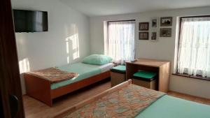 Postel nebo postele na pokoji v ubytování Jakišnica Apartment