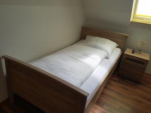 Postel nebo postele na pokoji v ubytování Pension Lindengarten