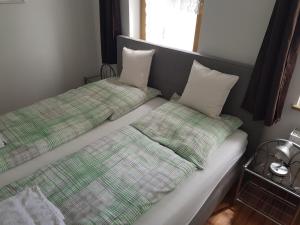 Postel nebo postele na pokoji v ubytování Pension Lindengarten