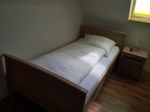 Postel nebo postele na pokoji v ubytování Pension Lindengarten