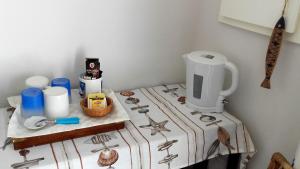 a table with a table cloth withautical items on it at Les Mouettes in La Cotinière +7 photos