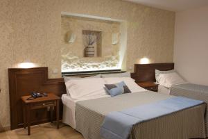Postel nebo postele na pokoji v ubytování Artemisia Resort