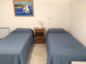 Una cama o camas en una habitación de Duplex Colina de Peralta Ramos