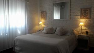 Postel nebo postele na pokoji v ubytování Hotel Las Liebres