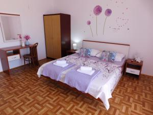 Postel nebo postele na pokoji v ubytování Guest house Ivanka