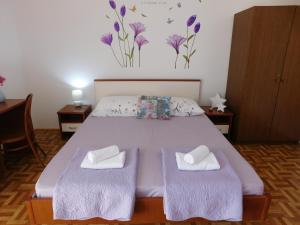 Postel nebo postele na pokoji v ubytování Guest house Ivanka