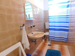 a bathroom with a sink and a toilet and a shower at Guest house Ivanka in Hvar