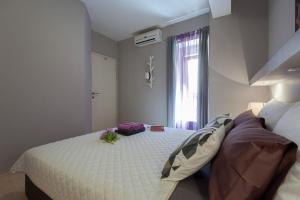 Posteľ alebo postele v izbe v ubytovaní Apartmani Ivanov Poljana