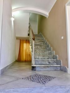 a staircase in a house with a concrete floor at Angioy 18 in Sassari