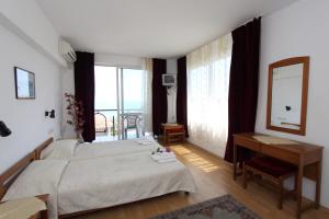 Postel nebo postele na pokoji v ubytování Family Hotel Verona