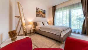 Un pat sau paturi într-o cameră la Vila Cotroceni Boutique Apartments