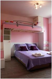 Postel nebo postele na pokoji v ubytování Apartman LORETTA