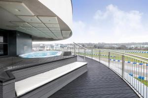 a hot tub on the balcony of a building at Brooklands Hotel & Spa in Weybridge