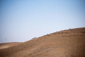 a group of people standing on top of a hill at Kfar Hanokdim - Glamping & Camping in Arad