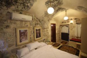 Postelja oz. postelje v sobi nastanitve Khan Alwakala Hotel