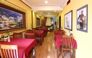 a restaurant with tables and chairs with red table cloth at Sapa Local House in Sapa