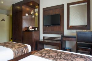 Postel nebo postele na pokoji v ubytování Castello Hotel