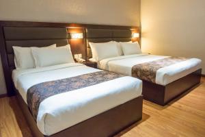Postel nebo postele na pokoji v ubytování Castello Hotel