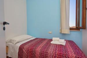 Postel nebo postele na pokoji v ubytování Residence Favignana