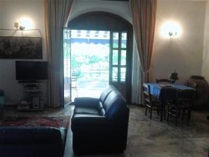 a living room with a couch and a table at Residence Gnura Momma in Locri