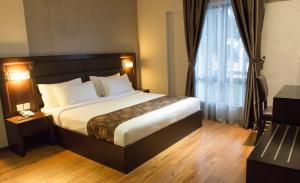 Postel nebo postele na pokoji v ubytování Castello Hotel