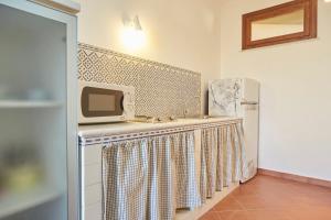 Kuchyň nebo kuchyňský kout v ubytování Residence Favignana