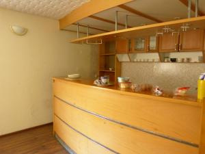 a kitchen with a wooden counter top in a room at Viva Pirita Hostel in Tallinn
