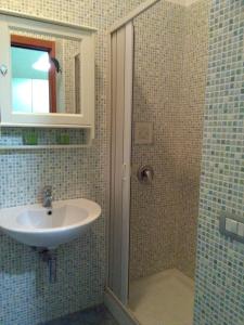 a bathroom with a sink and a shower at Domus Acanfora in Pompei +13 photos