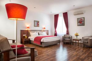 Postel nebo postele na pokoji v ubytování Greguar Hotel by UHM