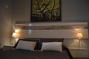 Łóżko lub łóżka w pokoju w obiekcie Apartamento El Mirador de Cadiz