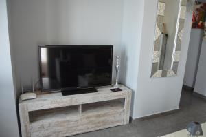 Telewizja i/lub zestaw kina domowego w obiekcie Apartamento El Mirador de Cadiz
