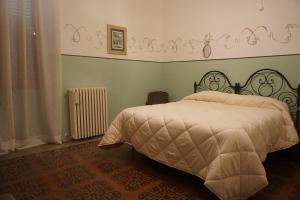 Postel nebo postele na pokoji v ubytování Palazzo De Fabritiis + 37 fotografií