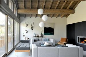 a living room with a couch and a fireplace at Home by U - Chalet 2 in Saint-Martin-de-Belleville