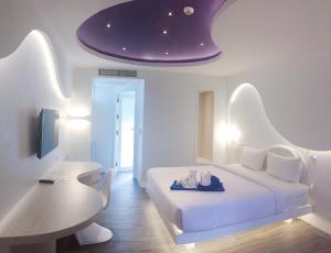Ένα ή περισσότερα κρεβάτια σε δωμάτιο στο Avatara Resort