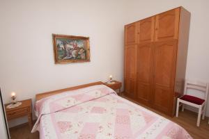 Posteľ alebo postele v izbe v ubytovaní Apartments Jolanda