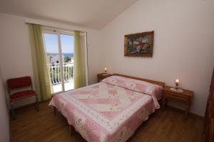 Posteľ alebo postele v izbe v ubytovaní Apartments Jolanda