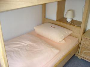 Un ou plusieurs lits dans un hébergement de l'établissement Ferienwohnanlage Partnach