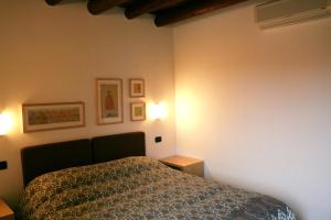 Postel nebo postele na pokoji v ubytování Agriturismo Nicobresaola