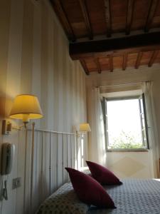 Postel nebo postele na pokoji v ubytování Villa Ducci