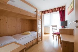 Postel nebo postele na pokoji v ubytování Pension Garden Hotel