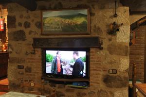Televisyen dan/atau pusat hiburan di Casa Rural La Pastera
