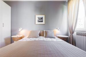 Łóżko lub łóżka w pokoju w obiekcie Apartments Tomislav Primorska