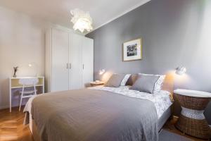 Łóżko lub łóżka w pokoju w obiekcie Apartments Tomislav Primorska